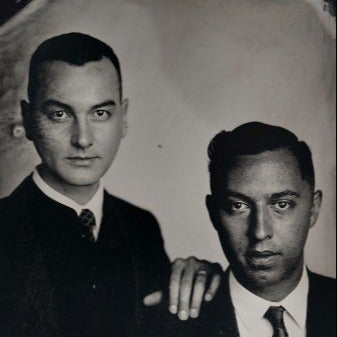 The Manichean black-and-white duo portrait from the band's Linktree profile