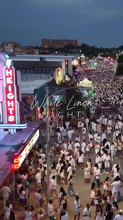 White Linen Night crowd filling the street outside the Heights Theater marquee.