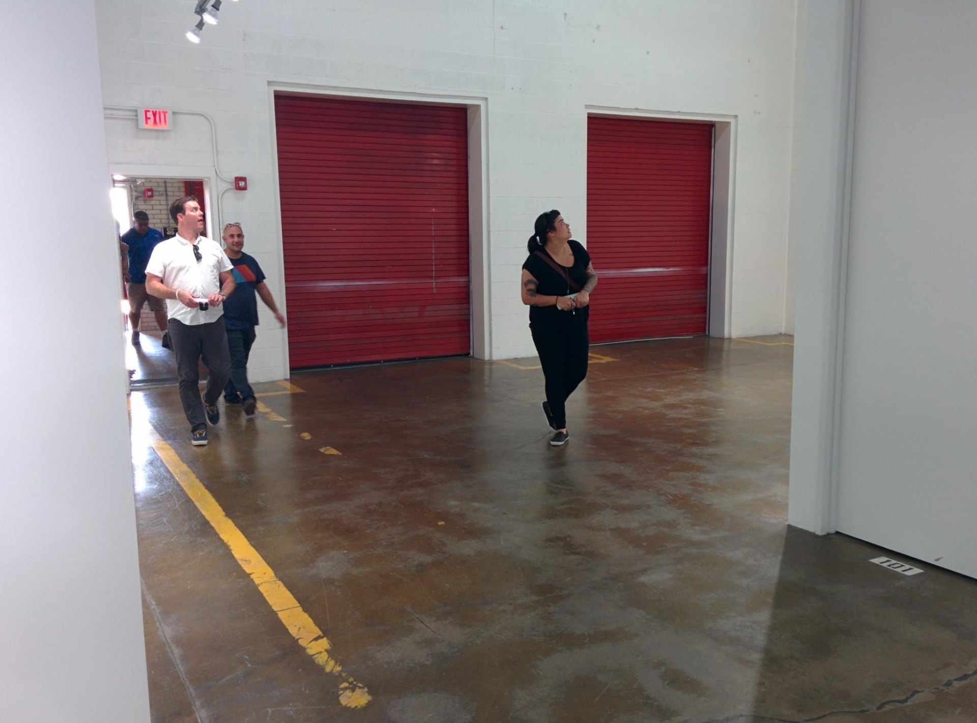 Silver Street Studios interior with red rolling doors during the exploratory Day for Night 2015 site visit.