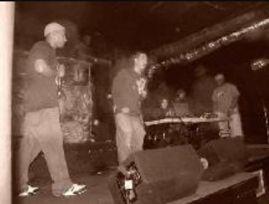 Studemont Project performing onstage.