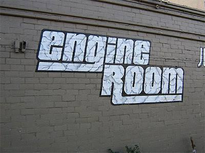 Painted Engine Room sign on the brick wall of 1515 Pease Street.