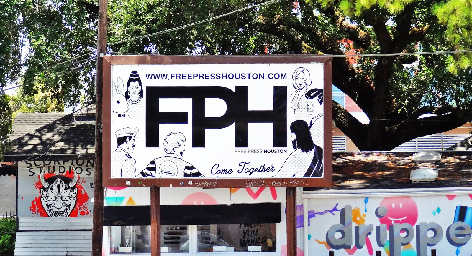 Free Press Houston billboard reading FPH, www.freepresshouston.com and Come Together, above Houston storefronts.