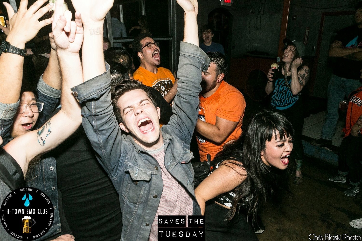 A crowd with arms raised, singing, in a dark club room. The frame carries an H-Town Emo Club / Saves The Tuesday mark and the credit line “Chris Blaski Photo”.
